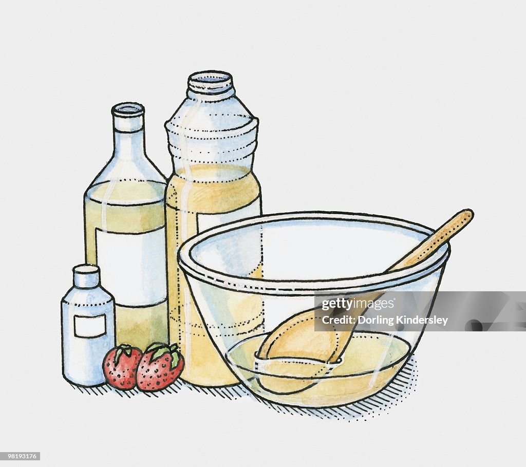 Bottles of olive oil, vegetable oil and coconut oil and two strawberries by a mixing bowl (making moisturiser)