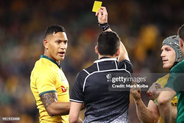 Israel Folau of the Wallabies is shown a yellow card by referee Pascal Gauzere as Michael Hooper of the Wallabies watches on during the Third...