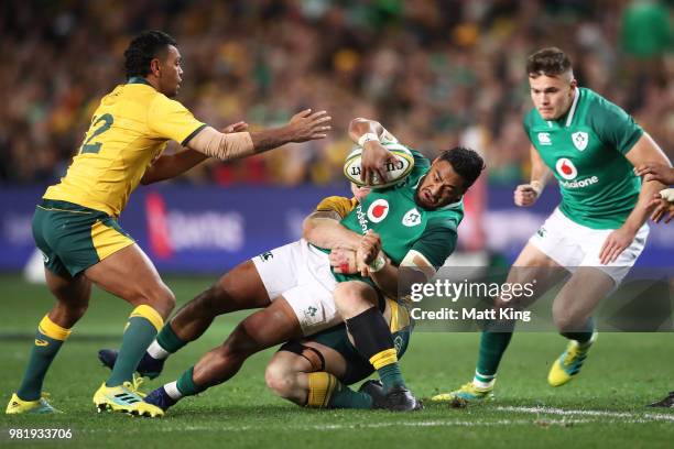 Bundee Aki of Ireland is tackled during the Third International Test match between the Australian Wallabies and Ireland at Allianz Stadium on June...