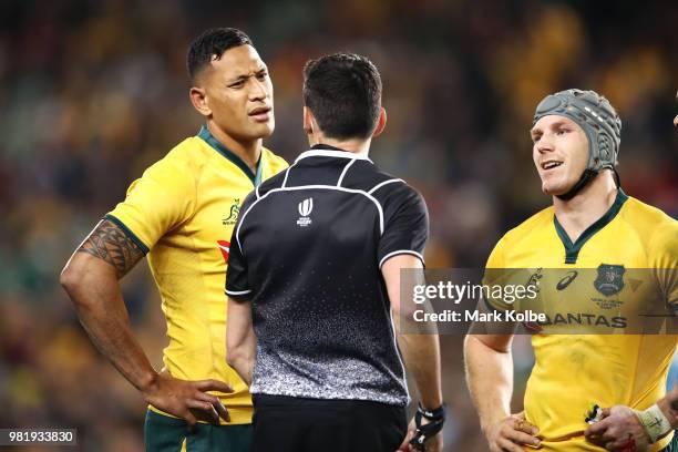 Israel Folau of the Wallabies is shown a yellow card by referee Pascal Gauzere as David Pocock of the Wallabies watches on during the Third...