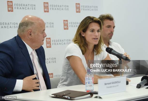 French former world number one Amelie Mauresmo speaks next to French tennis federation president Bernard Giudicelli during a press conference after...