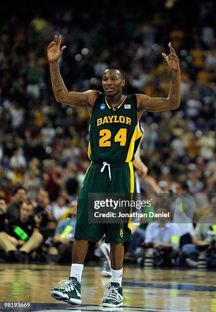 LaceDarius Dunn of the Baylor Bears encourages the crowd against the Duke Blue Devils during the south regional final of the 2010 NCAA men's...