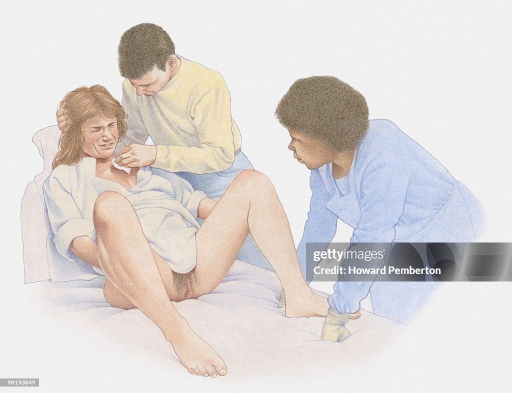 Woman in labour, with man and midwife beside her