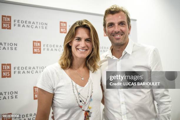 French former tennis players Amelie Mauresmo and Julien Benneteau pose after a press conference on June 23, 2018 in Paris after being respectively...