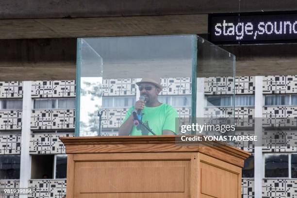 Ethiopia Prime Minister Abiy Ahmed delivers a speech behind a glass during a rally on Meskel Square in Addis Ababa on June 23, 2018. A blast at a...