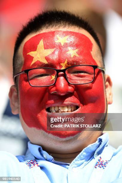 Chine fan looks on ahead of the Russia 2018 World Cup Group G football match between Belgium and Tunisia at the Spartak Stadium in Moscow on June 23,...