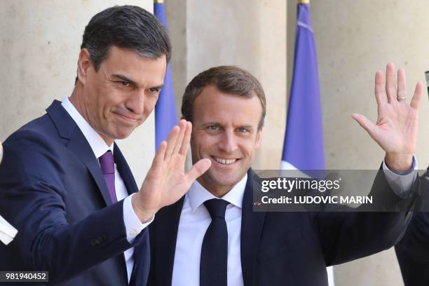 France's President Emmanuel Macron welcomes Spanish Prime Minister Pedro Sanchez at the Elysee Presidential Palace in Paris on June 23, 2018.