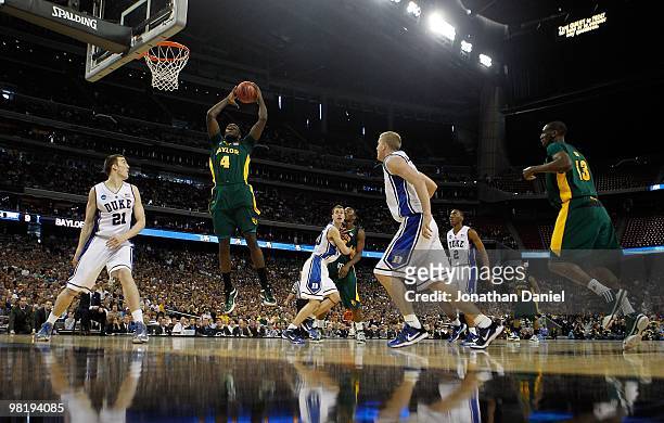 Quincy Acy of the Baylor Bears grabs a rebound against the Duke Blue Devils during the south regional final of the 2010 NCAA men's basketball...