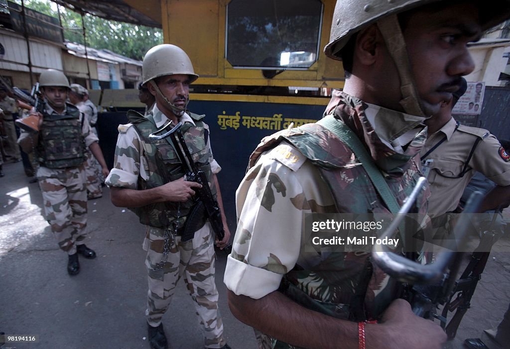 Ajmal Rathur Policemen guard the special court at Arthur Road jail where the trial ...