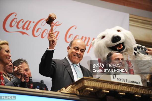 The Coca-Cola Company Chairman and CEO Muhtar Kent pounds the gavel just before he rang the closing bell of the New York Stock Exchange on March 30,...