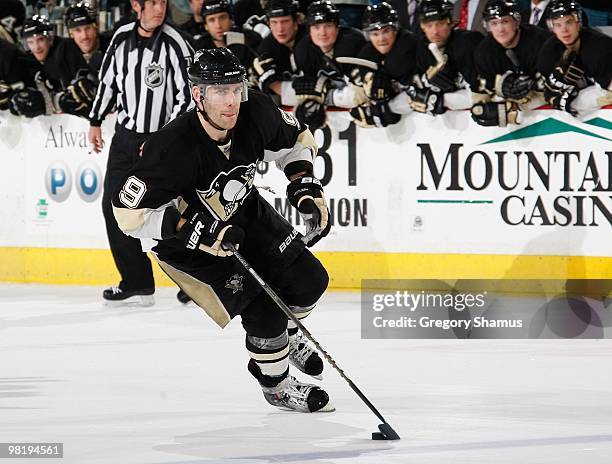 Pascal Dupuis of the Pittsburgh Penguins moves the puck up ice against the Toronto Maple Leafs on March 28, 2010 at Mellon Arena in Pittsburgh,...