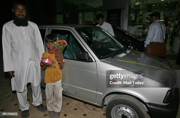 Abbas Ahmed, who bought the last model of the Maruti 800 on Wednesday, poses with the car in New Delhi on March 31, 2010. The last of the 27 lakh...