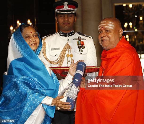 President Pratibha Patil presents the Padma Bhushan to Dr. Bala Gangadharanatha Swamiji at the Rashtrapati Bhavan in New Delhi on Wednesday, March...