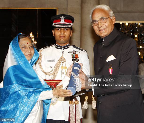 Kushal Pal Singh of DLF receives the Padma Bhushan from President Pratibha Patil at the Rashtrapati Bhavan in New Delhi on Wednesday, March 31, 2010.