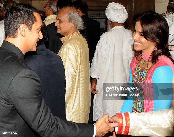 Actor Aamir Khan and badminton player Saina Nehwal after receiving his Padma Bhushan award at the 2010 Padma awards distributing ceremony at the...