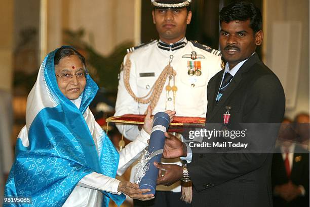 President Pratibha Patil conferring the Padma Shri award to hockey player Ignace Tirkey at the 2010 Padma awards distributing ceremony at the...