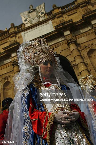 Penitent walks during an annual procession taking place on Holy Thursday in Marsala, on the italian island of Sicily on April 1, 2010. Actors and...