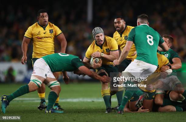 David Pocock of the Wallabies is tackled during the Third International Test match between the Australian Wallabies and Ireland at Allianz Stadium on...