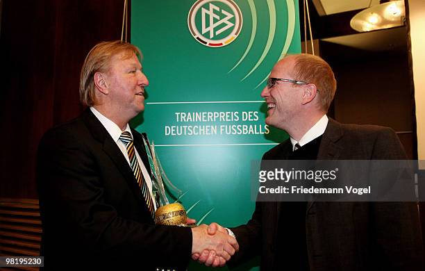 Former football player and youth trainer at the DFB Horst Hrubesch receives the Football Trainer of the year 2009 award from Matthias Sammer at the...