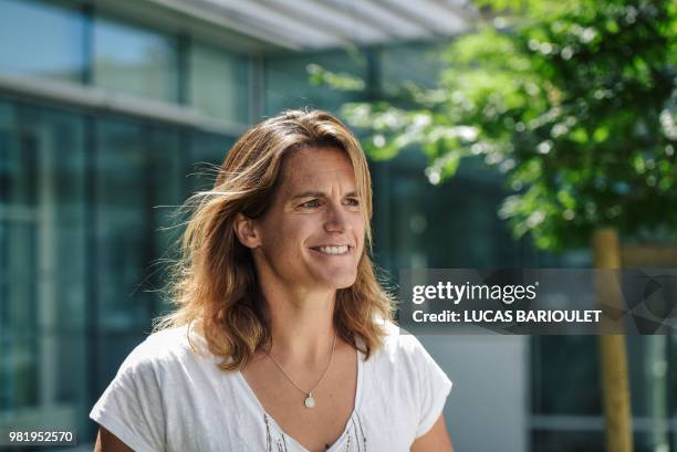 French former world number one Amelie Mauresmo poses following a press conference after she became the first woman appointed to captain France's...