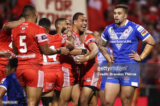 William Hopoate of Tonga celebrates with team mates after scoring a try during the 2018 Pacific Test Invitational match between Tonga and Samoa at...