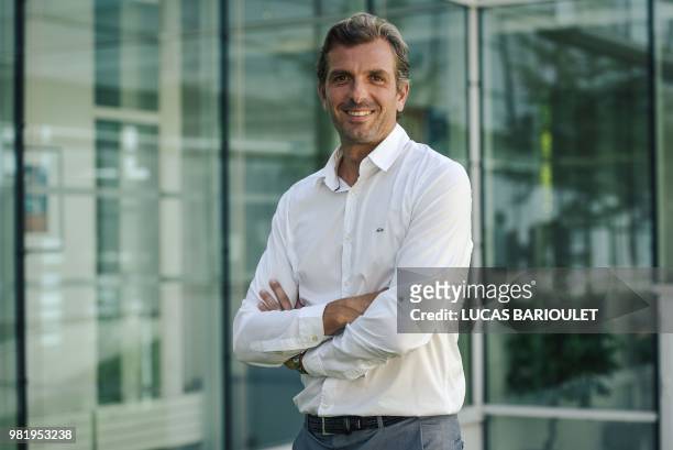 Julien Benneteau, who retires after the US Open in September, poses following a press conference after he was appointed at the reins of France's side...