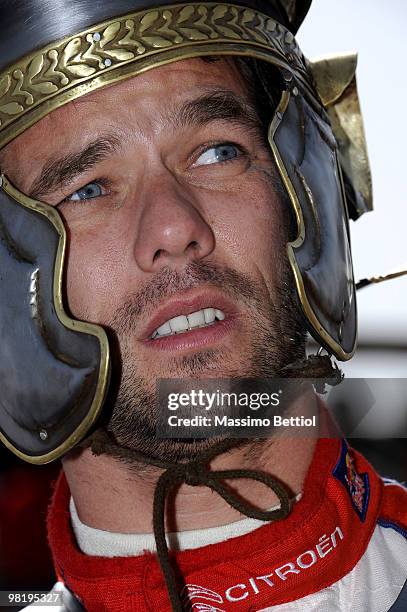 Sebastien Loeb of France pose for photographs dressed as a Roman gladiator before the official start of the WRC Rally Jordan from the millenary...