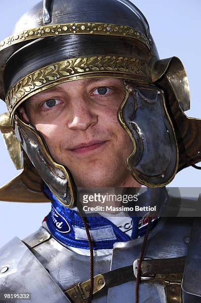 Mikko Hirvonen of Finland poses for photographs dressed as a Roman gladiator before the official start of the WRC Rally Jordan from the millenary...