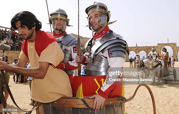 Sebastien Loeb of France and Daniel Sordo of Spain pose for photographs dressed as Roman gladiators before the official start of the WRC Rally Jordan...