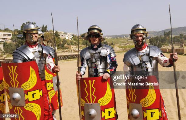 Daniel Sordo of Spain, Kimi Raikkonen of Finland and Sebastien Loeb of France pose for photographs dressed as Roman gladiators before the official...