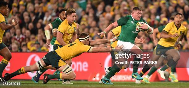 Ireland's John Ryan is persued by Australian Wallabies Izack Rodda , Michael Hooper and Israel Folau during the third and final rugby union Test...