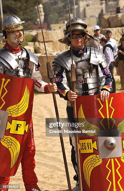 Daniel Sordo of Spain and Kimi Raikkonen of Finland pose for photographs dressed as Roman gladiators before the official start of the WRC Rally...