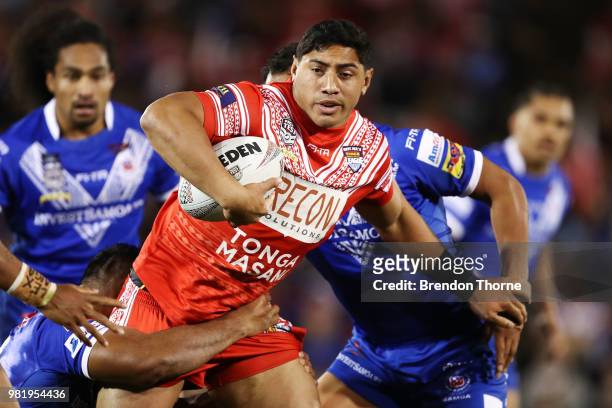 Jason Taumalolo of Tonga is tackled by the Samoan defence during the 2018 Pacific Test Invitational match between Tonga and Samoa at Campbelltown...
