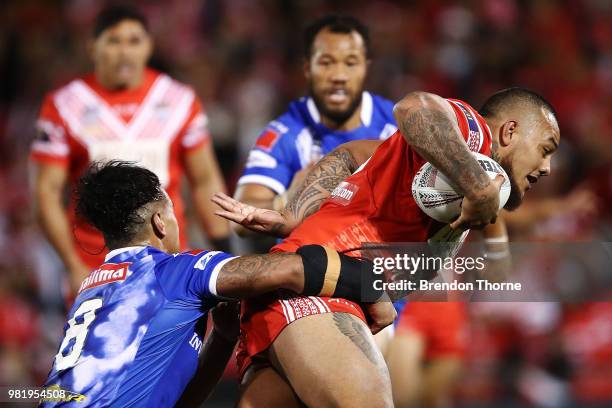 Addin Fonua-Blake of Tonga is tackled by the Samoan defence during the 2018 Pacific Test Invitational match between Tonga and Samoa at Campbelltown...