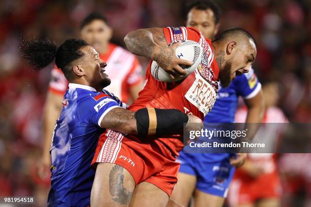 Addin Fonua-Blake of Tonga is tackled by the Samoan defence during the 2018 Pacific Test Invitational match between Tonga and Samoa at Campbelltown...