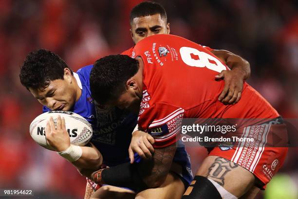 Mason Lino of Samoa is tackled by the Tongan defence during the 2018 Pacific Test Invitational match between Tonga and Samoa at Campbelltown Sports...