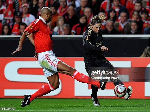 Fernando Torres of Liverpool kicks the ball past Luisao of Benfica during the first leg of the UEFA Europa League quarter finals between Benfica and...