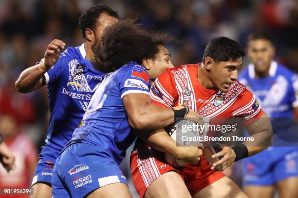 Jason Taumalolo of Tonga is tackled by the Samoan defence during the 2018 Pacific Test Invitational match between Tonga and Samoa at Campbelltown...