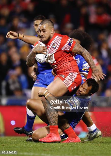 Addin Fonua-Blake of Tonga is tackled by the Samoan defence during the 2018 Pacific Test Invitational match between Tonga and Samoa at Campbelltown...