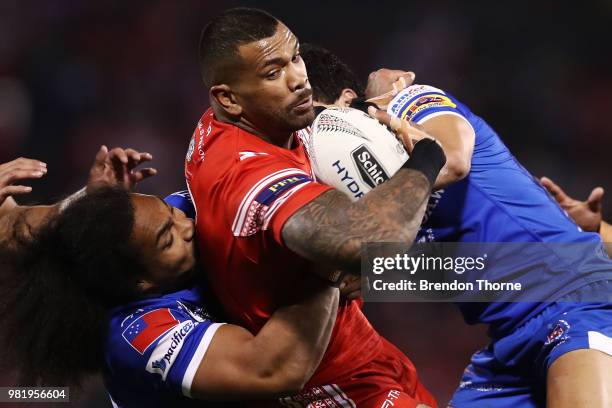 Manu Ma'u of Tonga is tackled by the Samoan defence during the 2018 Pacific Test Invitational match between Tonga and Samoa at Campbelltown Sports...