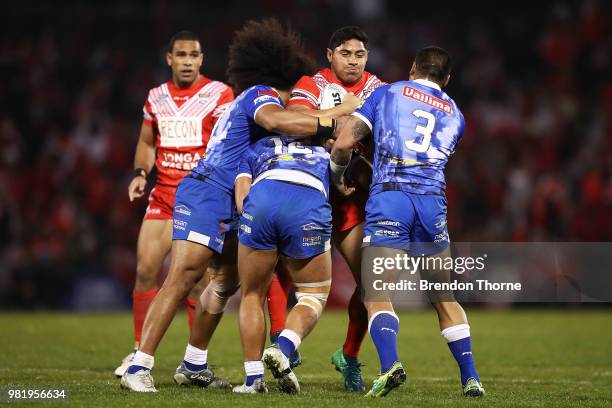 Jason Taumalolo of Tonga is tackled by the Samoan defence during the 2018 Pacific Test Invitational match between Tonga and Samoa at Campbelltown...