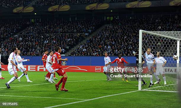 Dieudonné Mbokanie of Liege scores his team's first goal during the UEFA Europa League quarter final, first leg match between Hamburger SV and...