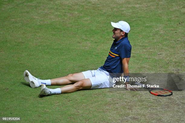 Roberto Bautista Agut of Spain reacts after picking up an injury in his half final match against Borna Coric of Croatia during day six of the Gerry...