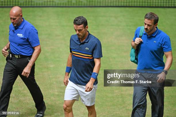 Roberto Bautista Agut of Spain reacts leaves the pitch after picking up an injury in his half final match against Borna Coric of Croatia during day...