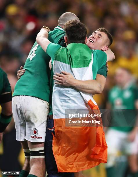 Pitch invader approaches Devin Toner and Jordan Lamour of Ireland as they celebrate at fulltime during the Third International Test match between the...