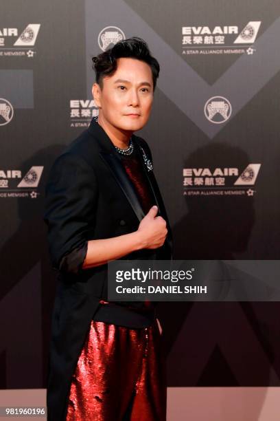 Taiwan singer Jeff Chang poses for photo upon arrival for the 29th Golden Melody Awards in Taipei on June 23, 2018. - Some of Mandarin pop music's...