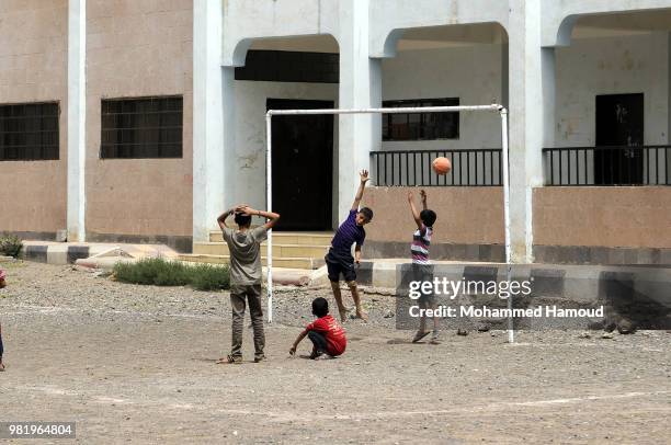 Yemeni displaced children play at a shelter after they fled their homes during fighting and airstrikes lunched to capture Yemen's western port city...