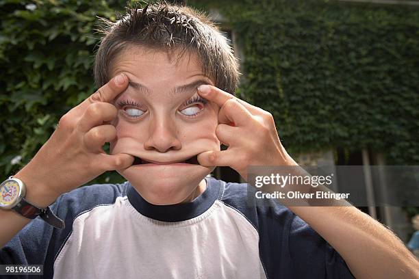 boy making faces - oliver eltinger stock pictures, royalty-free photos & images