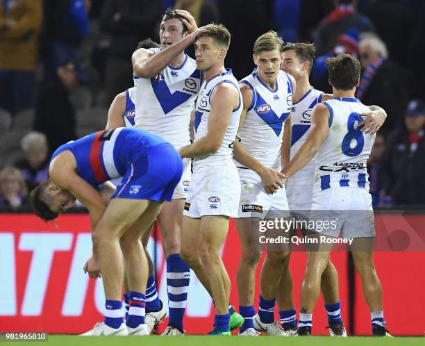 Kangaroos players celebrate winning the round 14 AFL match between the Western Bulldogs and the North Melbourne Kangaroos at Etihad Stadium on June...