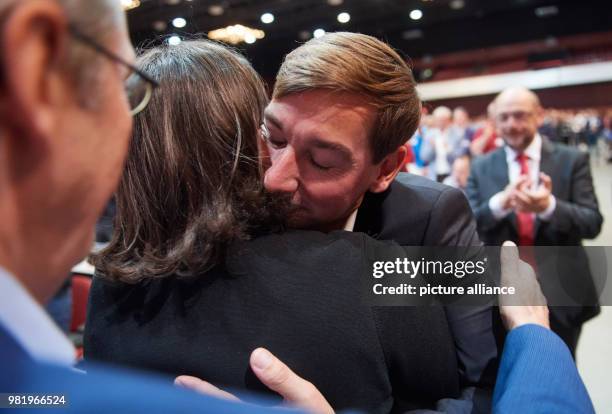 June 2018, Germany, Bochum: The newly-elected state chairman Sebastian Hartmann hugs Andrea Nahles, chairwoman of the Social Democratic Party , after...